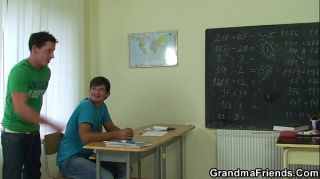 Very old teacher is pounded by two boys
