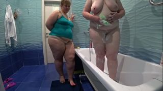 Lesbian washed and fucked a mature bbw in the bathroom. Milf shakes a big soapy booty doggystyle.