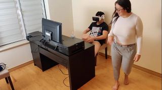 Hot stepmother masturbates next to her son while he watches porn with virtual reality glasses